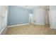 Spacious living room featuring tile floors, cool toned walls, a ceiling fan, and natural light at 1061 Citrus Landings Blvd, Davenport, FL 33837