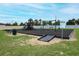 Community playground featuring swings, slides, and a climbing structure at 1061 Citrus Landings Blvd, Davenport, FL 33837