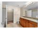 Bathroom featuring double sinks, granite countertops, and neutral tile flooring at 1101 Vintage Village Ln # 101, Ocoee, FL 34761