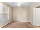 Comfortable bedroom with neutral tones, plush carpet and ample natural light at 1101 Vintage Village Ln # 101, Ocoee, FL 34761
