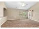 Bright living area with vaulted ceiling, neutral decor, and access to outdoor space at 1101 Vintage Village Ln # 101, Ocoee, FL 34761