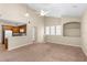 Inviting living room with high ceilings, neutral walls, and plush carpeting at 1101 Vintage Village Ln # 101, Ocoee, FL 34761