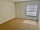 Cozy bedroom featuring carpet and window creating a comfortable space at 1110 Woodbine Street, Fern Park, FL 32730