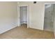 Bedroom featuring carpet and an open closet with bi-fold doors at 1110 Woodbine Street, Fern Park, FL 32730