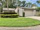Charming home with lush landscaping and a well-maintained lawn at 1110 Woodbine Street, Fern Park, FL 32730