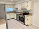 Bright kitchen featuring stainless steel appliances and ample countertop space at 1110 Woodbine Street, Fern Park, FL 32730