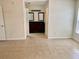Bedroom with tile floors showing dual vanities and a walk through to the bathroom at 1110 Woodbine Street, Fern Park, FL 32730