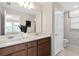 The bathroom features double sinks, granite countertops, and modern fixtures at 11429 Nona Sound St, Orlando, FL 32832