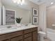 Modern bathroom featuring a double vanity, ample lighting, and a shower-tub combination at 11429 Nona Sound St, Orlando, FL 32832