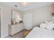 Bright bedroom featuring neutral tones, a comfortable bed, and stylish decor for a serene retreat at 11429 Nona Sound St, Orlando, FL 32832