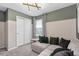 This cozy bedroom features stylish decor, soft carpet, and a comfortable couch, perfect for relaxation at 11429 Nona Sound St, Orlando, FL 32832