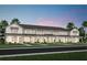 Beautiful new construction townhomes featuring an attractive facade with covered porches and lush landscaping at 11429 Nona Sound St, Orlando, FL 32832
