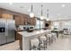 Modern kitchen featuring a large island with seating, stainless steel appliances, and plenty of cabinet space at 11429 Nona Sound St, Orlando, FL 32832