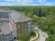 Aerial view showing building and pond for property location and surrounding landscape at 1200 Ironsmith Dr # 508, Celebration, FL 34747