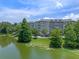 Building exterior next to pond creating beautiful scenery within the community at 1200 Ironsmith Dr # 508, Celebration, FL 34747