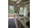Bright bathroom with double vanity, ample counter space, and large windows offering natural light at 1200 Ironsmith Dr # 508, Celebration, FL 34747