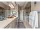Spacious bathroom with double vanity, framed mirrors, granite countertops and luxurious fixtures at 1200 Ironsmith Dr # 508, Celebration, FL 34747