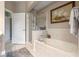 Bright bathroom featuring a separate shower and tub with neutral tile surround and modern fixtures at 1200 Ironsmith Dr # 508, Celebration, FL 34747