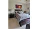 Comfortable bedroom showcasing a queen-size bed with a decorative painting above it at 1200 Ironsmith Dr # 508, Celebration, FL 34747