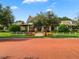 Beautiful clubhouse with manicured lawn and colorful landscaping at 1200 Ironsmith Dr # 508, Celebration, FL 34747