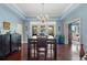 Elegant dining room featuring hardwood floors, decorative lighting, and large windows at 1200 Ironsmith Dr # 508, Celebration, FL 34747
