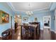 Dining room with hardwood floors, chandelier, and access to multiple rooms at 1200 Ironsmith Dr # 508, Celebration, FL 34747