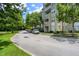 Condos featuring neutral paint with white trim and balconies surrounded by manicured landscaping and tree lined streets at 1200 Ironsmith Dr # 508, Celebration, FL 34747