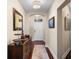 Hallway with hardwood floors, neutral walls, elegant decor, and recessed lighting at 1200 Ironsmith Dr # 508, Celebration, FL 34747