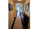 Inviting hallway with elegant decor, hardwood floors, and arched entryway to a cozy living space at 1200 Ironsmith Dr # 508, Celebration, FL 34747