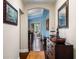 Hallway with hardwood floors, neutral walls, elegant decor, and archway entrance at 1200 Ironsmith Dr # 508, Celebration, FL 34747