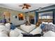 Spacious living room with a stone accent wall, an oversized couch, and an entertainment center at 1200 Ironsmith Dr # 508, Celebration, FL 34747