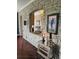 Open-concept living area with stone accents, modern lighting, and elegant decor creating a warm ambiance at 1200 Ironsmith Dr # 508, Celebration, FL 34747