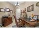 Home office with rich wood furniture, decorative accents, and a comfortable workspace at 1200 Ironsmith Dr # 508, Celebration, FL 34747