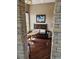 Cozy sitting area with decorative bench, small table, and view from stone accented wall at 1200 Ironsmith Dr # 508, Celebration, FL 34747