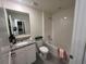 Bright bathroom features a granite countertop and tiled shower/tub combo at 12035 Holystone St, Winter Garden, FL 34787