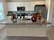 Spacious kitchen island with granite countertop and white cabinets, perfect for entertaining at 12035 Holystone St, Winter Garden, FL 34787