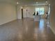 Open-concept living room featuring tile floors and ample natural light at 12035 Holystone St, Winter Garden, FL 34787