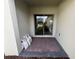 Private patio with patterned brick pavers and sliding glass doors at 12035 Holystone St, Winter Garden, FL 34787