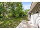 Spacious backyard with concrete patio and privacy landscaping at 13018 S Sunset Ter, Winter Garden, FL 34787