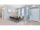 Dining room with table, chairs, and two paintings on the wall at 13018 S Sunset Ter, Winter Garden, FL 34787