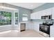 Eat-in kitchen with stainless steel appliances and a view of the backyard at 13018 S Sunset Ter, Winter Garden, FL 34787