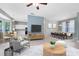 Living room featuring a modern kitchen, dining area, and comfortable seating at 13018 S Sunset Ter, Winter Garden, FL 34787