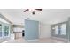 Open living area with a modern kitchen and ample natural light at 13018 S Sunset Ter, Winter Garden, FL 34787