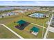 Aerial of a community with lake view, pool, and playground, highlighting the community's Gathering-friendly atmosphere at 1345 Griffon Ave, Lake Alfred, FL 33850