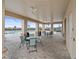 Covered poolside lounge area with tables and chairs, providing a comfortable space for residents to relax and socialize at 1345 Griffon Ave, Lake Alfred, FL 33850