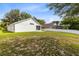 Expansive backyard features ample green space, a white fence, and a screened-in porch at 139 Andrews Rd, Sanford, FL 32773