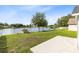 Lush backyard with a serene lake view, perfect for outdoor enjoyment at 139 Andrews Rd, Sanford, FL 32773