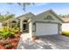 Charming single-story home with well-maintained landscaping and a two-car garage at 139 Andrews Rd, Sanford, FL 32773