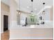 Open kitchen view with white cabinets, stainless steel appliances and granite countertops at 139 Andrews Rd, Sanford, FL 32773