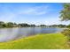Expansive lake view with manicured lawn, ideal for peaceful outdoor living at 139 Andrews Rd, Sanford, FL 32773